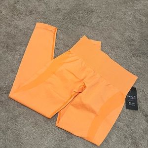NVGTN SUNSET ORANGE CONTOUR SEAMLESS LEGGINGS